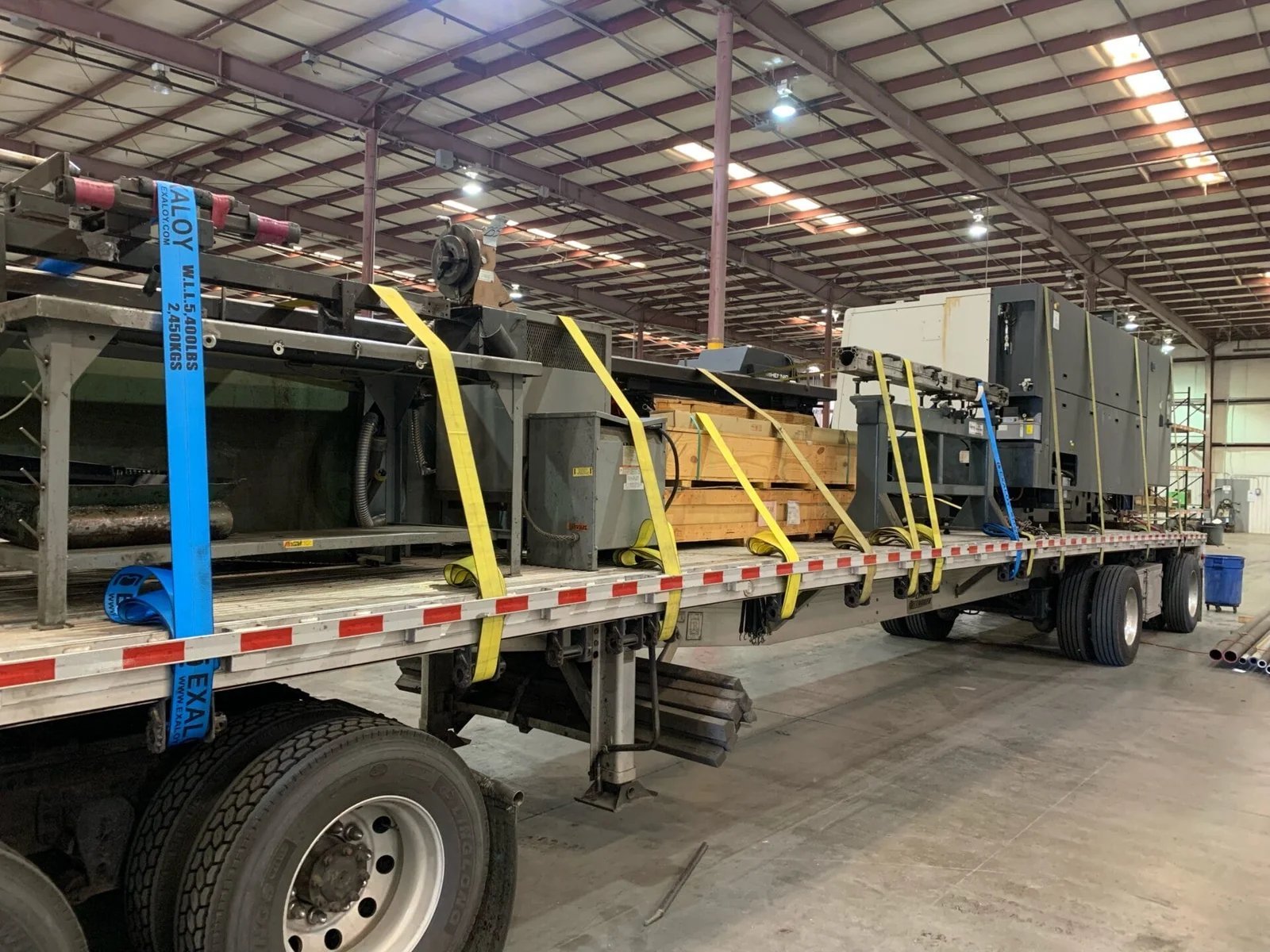 Factory machinery secured flatbed plant relocation USA Mexico AZVIR